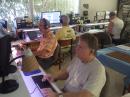 Sunday afternoon at PJ2T with about 8100 QSOs in the log and four hours remaining. PJ2T ended up with the high claimed score in M/M from the DX side. Foreground Keith (WA9S) on 20, checkered shirt Gene (KB7Q) on 40, Mark (N5OT) at back left on 10, and Jim (WI9WI) at back right running 15 meters. 