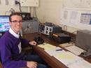 K-State Amateur Radio Club President James Copeland takes a break between contacts to pose for a photo.  According to legend, the KSUARC has been in operation since 1927.