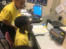 General class operator Alex gives some pointers to Jarobie between QSO's.