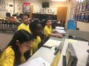 Violet and Jarobie work the station during SCR while Alex and Maverick look on.
