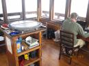 And, if your not working the radio, you can play being a fire lookout.  Some of the original equipment, including the table to determine azimuths is still there.
