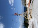 Matt, KC1XX operating as HI0LT, standing on his homebrew rooftop tower in Sosua