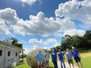 Our Team after an educational exercise in setting up an inflatable parabolic antenna for satellite communications used in disaster response