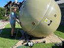Ben (KN4VPH) points the inflatable antenna to the satellite as part of the educational exercise at 2021 field day.