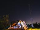 The Nashoba Valley Amateur Radio Club's tri-band beam with an 80m and 40m dipole towers over the CW tent at the Heald Road Orchard in Pepperell, MA during Field Day 2016.  Photo taken at 11:30 pm.