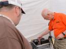 Skip Youngberg, K1NKR, demos his DATV setup for Jesse Creamer, W1DEA.