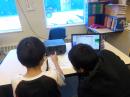 Students working a contact at KL7DG Pilot Station School.