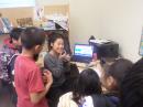 Ariel Tweto (Flying Wild Alaska) takes a turn at the mike with the students of Pilot Station School (KL7DG) during the Feb 2015 School Club Round Up. 