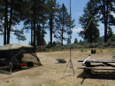 Operating station overview. The canopy on the left houses the power supply, computer, transceiver, and accessories. The tower at right supports what I call my "Emcom DIpole". 