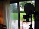 View from behind the dish looking out into the rain. If you
are in your own house, is that "arm chair copy" ?
