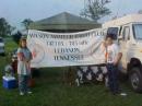 Julie Harris -KG4SCU and Stephen Stoles hang the club banner first thing Saturday morning.