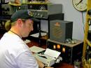 Here's Peter, AD7EU, having QSO with N7KO in Flagstaff, AZ. Peter brought his typewriter to copy the Morse code with. The typewriter was on the same table as the receiver which caused the received CW note to 'warble' as each key was struck. Note a huge problem, though... Peter received a SKN of 559 from Rick. Rick also noted that W7OS's distinctive chirpy signal helped bring it out of the SKN QRM.