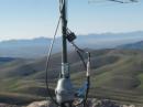 The antenna is fed with 125' of 1/2" hardline. The trailer sits on the trail about 75' below.