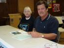 Club member Deyl Dillard, KD4FD looks on as Mayor Larry Justice signs Amateur Radio Week Proclamation for W4HOD.