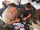Philip KA4KOE shows a scout how to solder. No one was burned!
