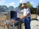 KD5MML manning the grill <i>photo by KE5QZQ</i>