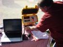 VE8MAP fiddles with knobs on the SAR radio