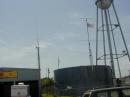 Old Glory waving proudly atop portable tower set up.