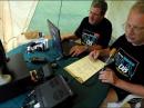 Jim Elliott, N2UHJ Field Day Chairperson, left, and Bill Busch, N2WUT, EOC Director, work a radio station in a tent, one of four, at the North Tonawanda Fire Department, Saturday, June 28, 2008. The amateur radio operators were on hand as part of a nationwide disaster preparedness drill. - Credit: Doug Benz / Staff Photographer - Tonawanda News