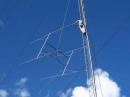 hauling up the new 222 MHz array in August before the big September Contest. All four long yagis were built on the ground, then hauled up in one piece to the 100 ft level.