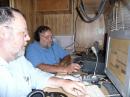 Tom, AL7AU (Left) and Les, N7CMJ, operate 20 meters, running them as fast as possible!