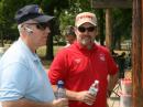 Andy W6AWS gives Ben from the California Office of Emergency Services (OES) an overview of our Field Day operations.