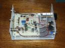 Peek at the insides of the receiver. Very simple layout with three-crystal ladder filter for good selectivity.