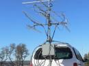 Mast at traveling height (11') showing microwave equipment box all attached to the mobile "rotating tower".