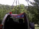Operating location w/ camera tripod on roof. Wire dipole is about 10 feet. Red towel is weak attemp at a sunshade!