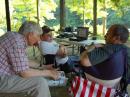 W9LYN (Bill) helping Kyle (center) with the Boy Scout Radio Merit Badge questions.