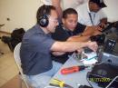 KP4ARR sharing his knowledge in CW with one of the EOC crew.