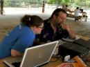 Courtney Miller, left, watches while her father, Glen Miller
(KC5KMK), shows her how to make a contact. Glen served as GOTA coach for the Pearl River County Amateur Radio Club at the Field Day 2009 event. Photo by Larry Wagoner (N5WLW).