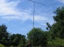 Dave, WD8IOU, standing next to our 30' tip up mast with 6 meter beam on top and rotor on the bottom.  We have 250' of 1/2" Heliax running out to this antenna in order to keep it from interfering with the other HF stations.