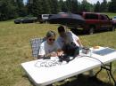 Nick W8XD at the controls of the FT817 on 40cw powered by a solar panel and Pete N8PR trying to keep the operator cool at the same time!