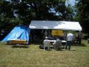 CW tent on the left under the blue tarp (you can't see the computer screen with the sun shining down on the tent).  The shelter to the right is where everyone gathers.  The table is loaded with great food and snacks!