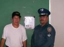 THE REPRESENTATIVE FROM THE POLICE DEPT. WITH OUR PRESIDENT GILBERTO NP3AQ
