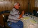Ken, N5GAA, president of the Wild Horse Desert Hams, took the first turn at the HF rig during Field Day 2003. (photo by Pat, KD5TXD)