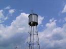 Chris Noel NO4EL climbing the water tower to suspend one of several dipole antennas for our 5F operation.