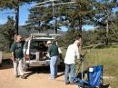 (L-R) John Bredehoft, KØFTC, Don Nelson NØYE and Oz DiGennarro, ABØIZ set up for the next pass of a "Bird". This was a first for Oz and John and they really took interest and made five satellite QSO's. 