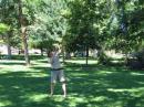 Rick Hess, kc0nzw, using his bow and arrow to get fishing line up high in the trees.