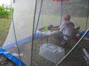 The operating position with solar panel behind the tent.