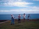 Raising the 80 meter vertical. N0DQD, KH7CC, WH7NH - Diane and AH6RQ - Joe.
