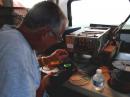 Time for a little rig repair with an ocean view. KH7CC working on his amplifier.