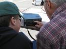 Bruce KE7FTI showing Austen how to operate the rig.