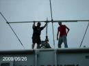 KC9NVV and KC9JIK mounting the tri-bander to the telescopic mast. Never mind the date stamp. The camera had not been used for a while and the date was never checked.