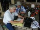 Tom, WA0RWL, operating the GOTA Station with John, WA4QMQ, cheering Tom on.