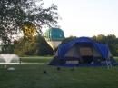 Hot air balloons float by during setup Friday evening