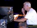 K4YNZ working 20M phone, surrounded by his collection of Drake transcievers