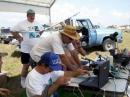 KD5GJR, Randy Bates, KD5UJY, KD5UJX, Bill Albert, and others get the VHF station set up for the test.