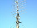 What happens when someone runs amok with loop yagis. Quad arrays on 903 thru 3456 MHz. The top array is the 4 X 112 el
Blowtorch array. (New this summer) It works like a six ft dish at 138 ft. Don't ask how I got it up there!  